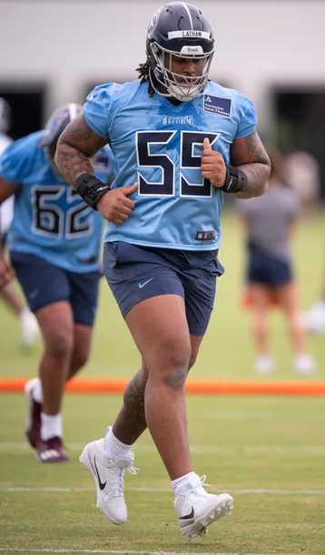 Giant Titans Rookie JC Latham Battles To Move Blocking Sled